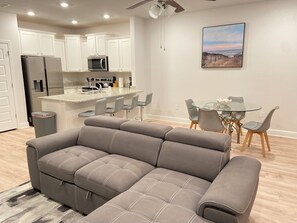 A modern kitchen with white cabinets, a built-in microwave, and a stainless steel refrigerator. - San Destin Dream Vacation 3-bedroom townhome in beautiful Santa Rosa Beach. (SANTA RSA BCH)
