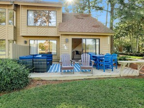 A two-story house with a patio area featuring outdoor furniture and a covered seating area. - 🌞Fairways 307~Pool~Stunning Views🌞 (Miramar Beach)