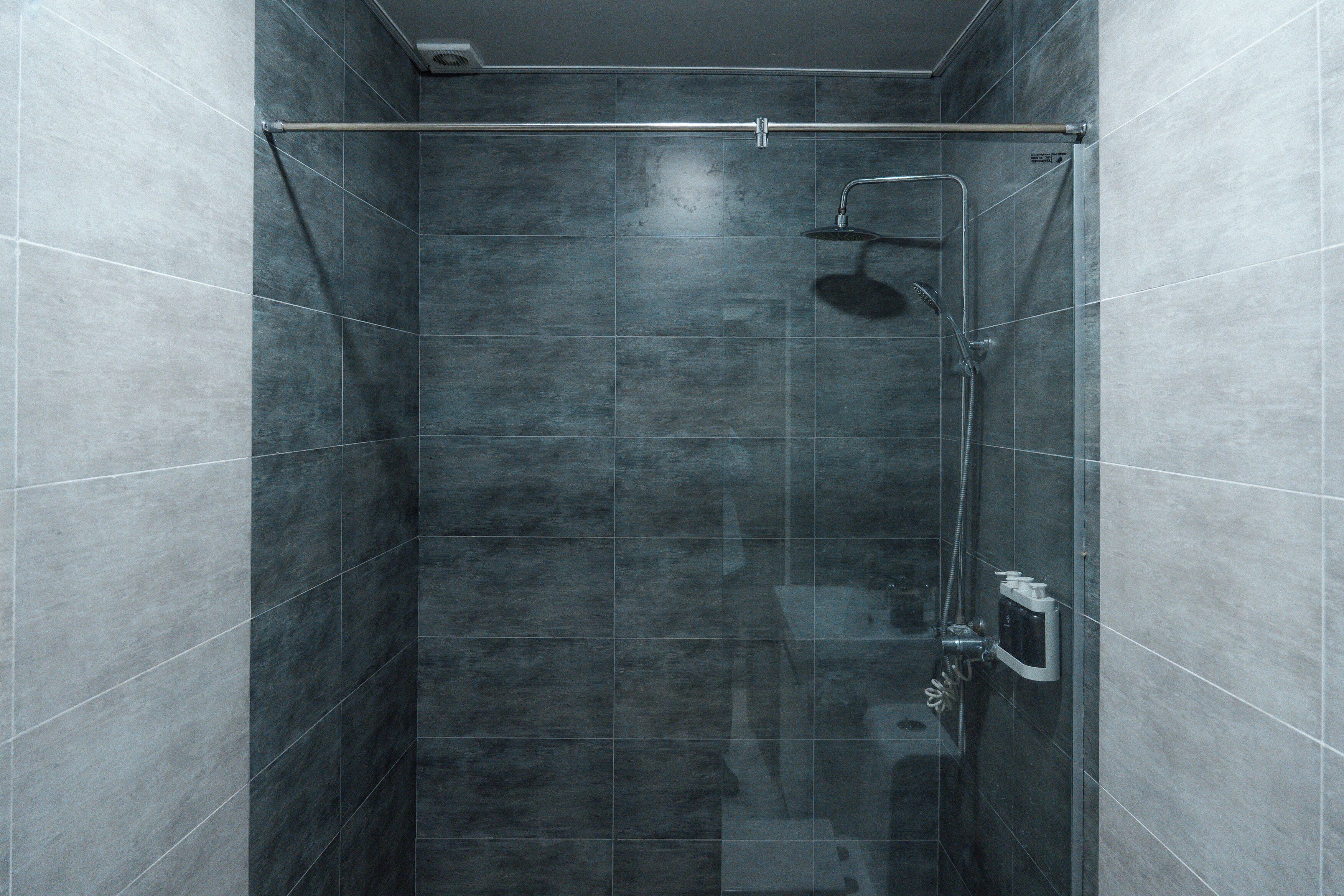 Shower, hair dryer, slippers, towels