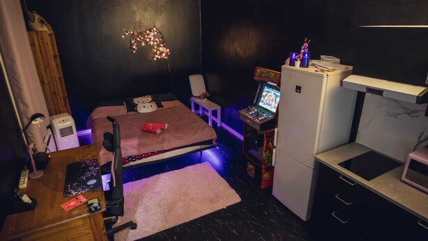 A compact room with a bed, desk, computer, and a small kitchenette. - 2-room apartment with air field hockey arcade machine and computer (Vitry-sur-Seine)