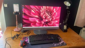 A desktop computer with a monitor, keyboard, and mouse on a wooden desk. - 2-room apartment with air field hockey arcade machine and computer (Vitry-sur-Seine)