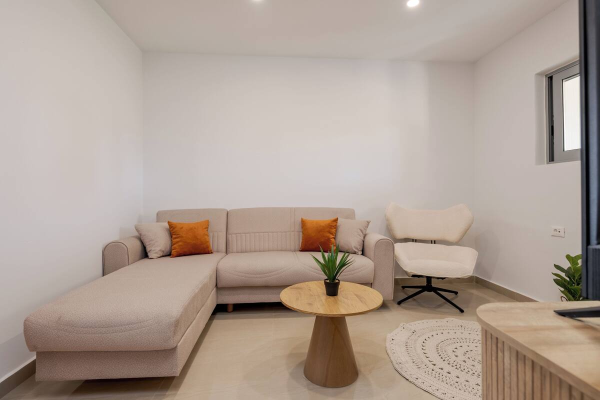 Deluxe Suite, 2 Bedrooms, Garden View, Ground Floor | Living area | 28-inch Smart TV with digital channels