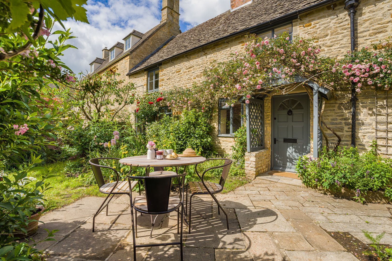 Rose Cottage's idyllic chocolate-box Cotswold stone exterior.