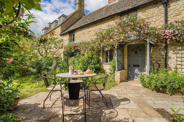 Rose Cottage's idyllic chocolate-box Cotswold stone exterior.