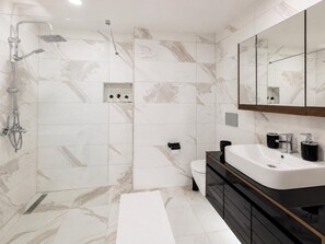 Separate tub and shower, deep soaking tub, hair dryer, towels