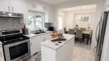 Coffee/tea maker, fridge, microwave, oven