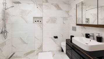 Separate tub and shower, deep soaking tub, hair dryer, towels