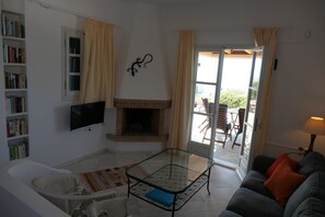 Villa, 3 Bedrooms, Smoking, Balcony | Living room | Books - Charming Naxos Villa, Ocean Views, Modern Comfort, Tranquil Escape (Naxos)