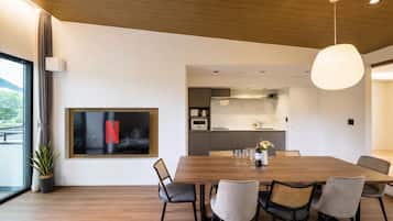 Superior Villa | Living area | 55-inch LCD TV with digital channels, streaming services
