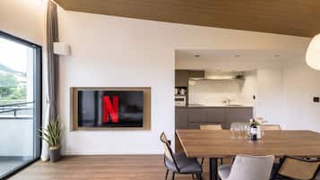 Superior Villa | Living area | 55-inch LCD TV with digital channels, streaming services