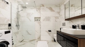 A modern bathroom with a shower, toilet, and sink. - Gorgeous 3 Bedroom Apartment At Monnas Suite (Beyoglu)