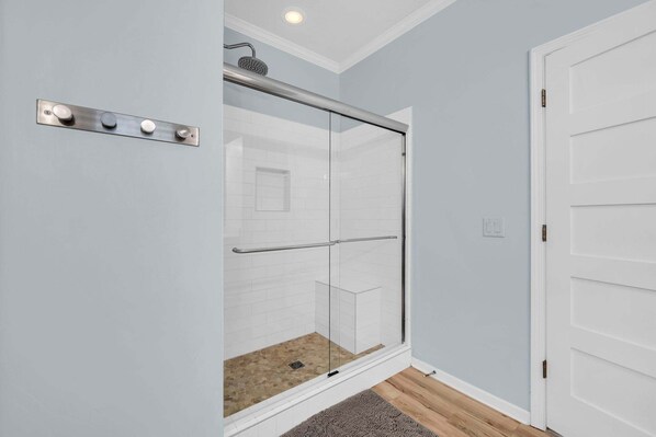 A modern bathroom with a glass shower enclosure, a white door, and a light blue wall. - 🦩Book Me Baby! Juan Sweet Beach House in Santa Rosa Beach🦩 (Santa Rosa Beach)