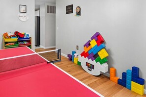 A room with a ping pong table, colorful building blocks, and a Tetris game. - Perfect for Families, Pet Friendly, Games Room (Ballwin)
