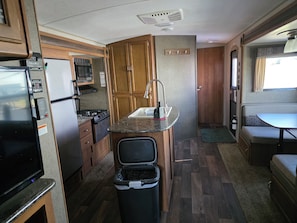 Private kitchen - Lovely 2-bedroom recreational vehicle with full bath and AC in Sergeant Bluff. (Sergeant Bluff)