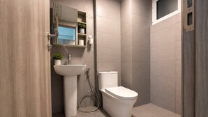 A modern bathroom with a pedestal sink, toilet, and a small window.