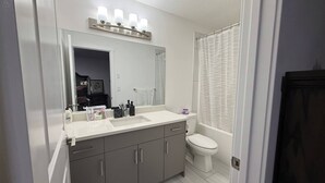 A bathroom with a vanity, sink, mirror, and toilet. - Room-elegant Private Room With En-suite (Edmonton)