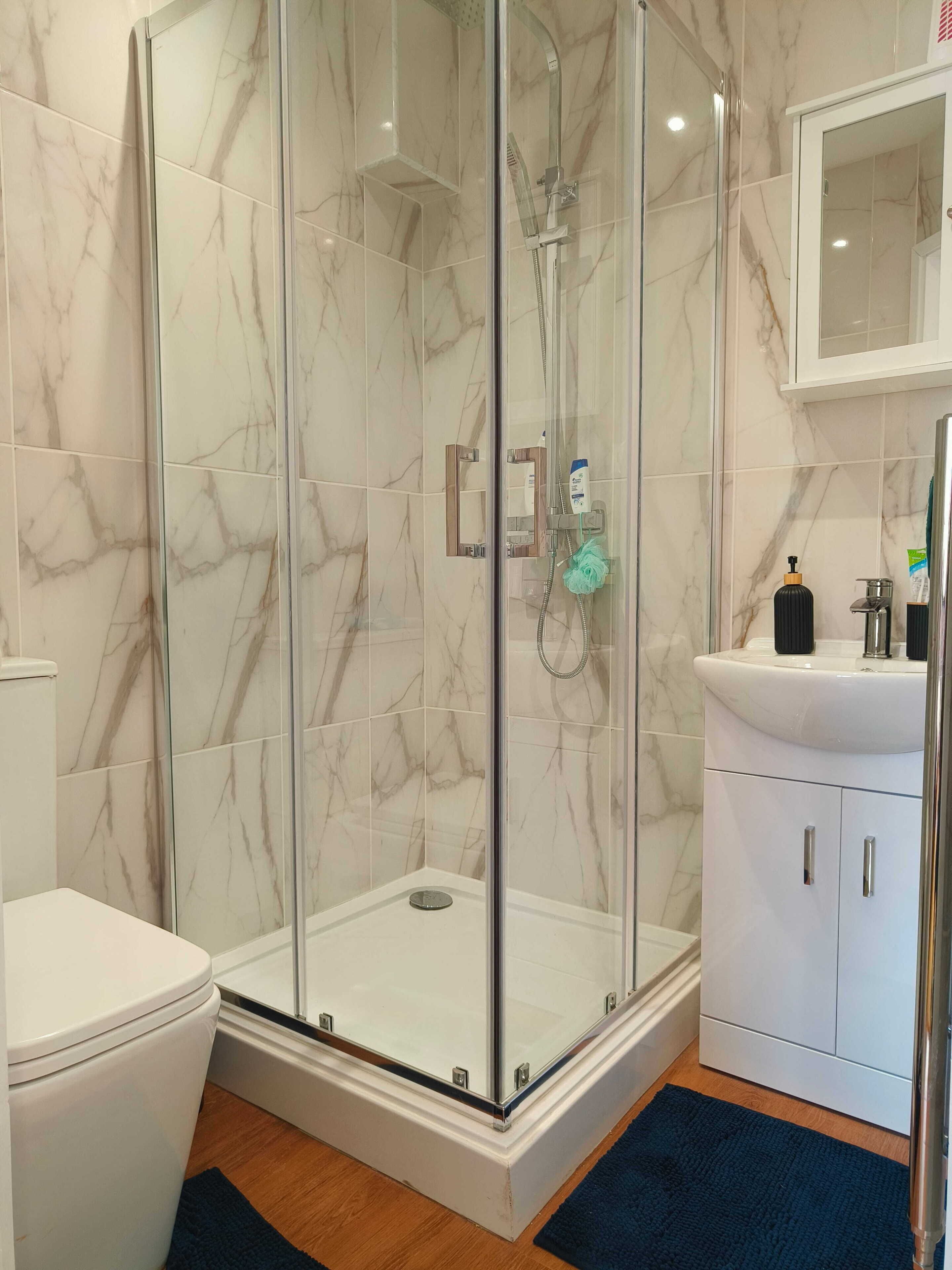 Shower, hair dryer, towels, soap