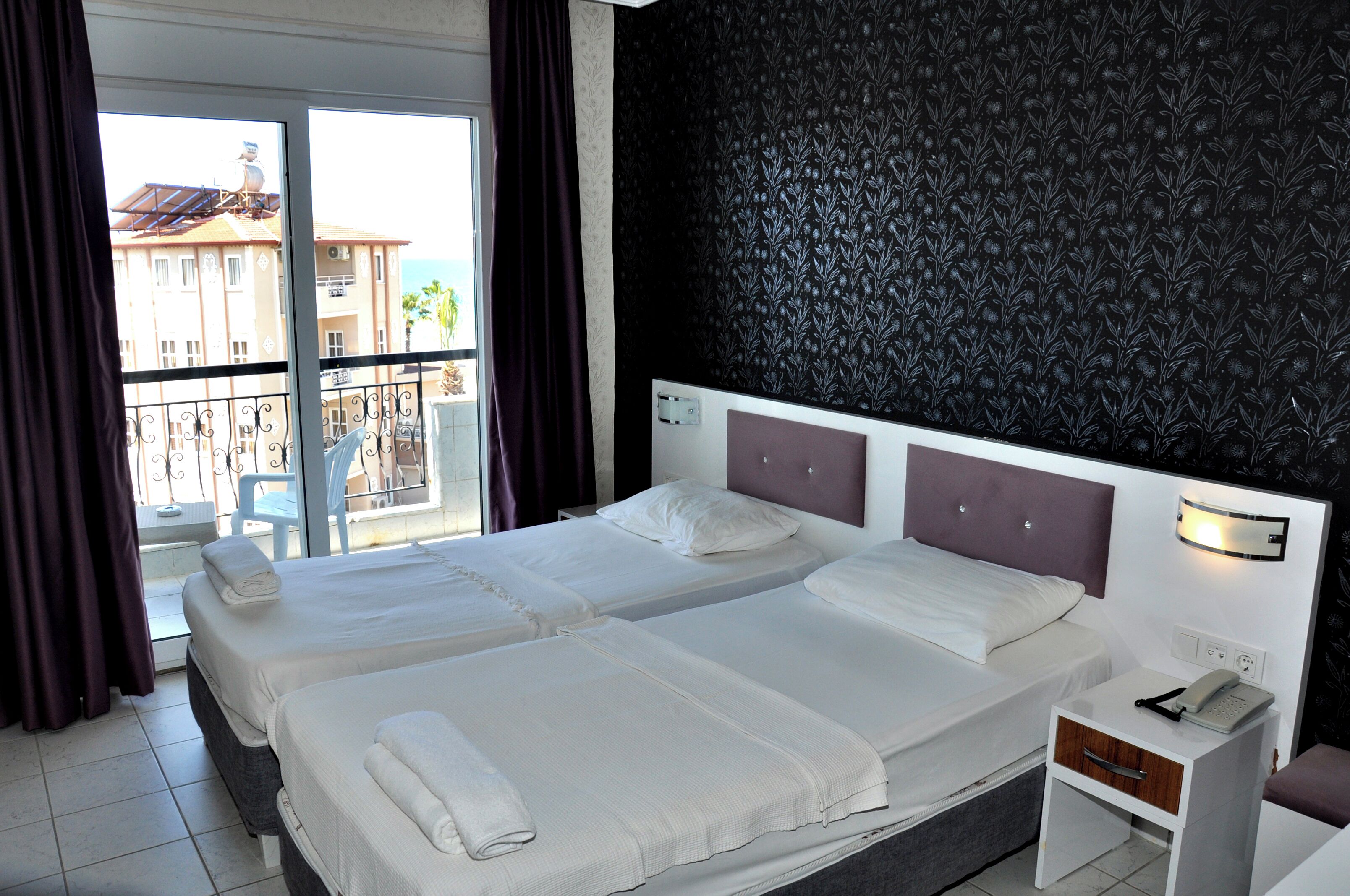 Classic Twin Room, Balcony, Beach View | Desk, laptop workspace, blackout curtains, soundproofing