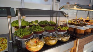 A buffet with various food items, including salads, vegetables, and other dishes. - SAYGILI BEACH HOTEL (Manavgat)