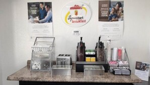A breakfast bar with a coffee machine, toaster, and hot water dispenser. - Junior Room with Queen Bed|Nsmk (Barstow CA)