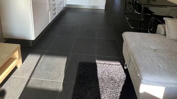 Apartment, 1 Bedroom, Patio | Living area | Books