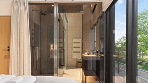 A modern bedroom with a large bed, a glass shower enclosure, a bathroom with a sink, and a balcony with a view.