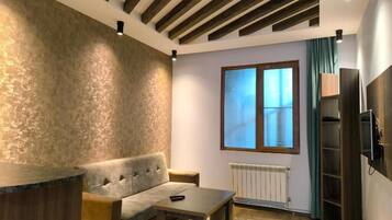 Comfort Quadruple Room, Courtyard View | Free WiFi, bed sheets
