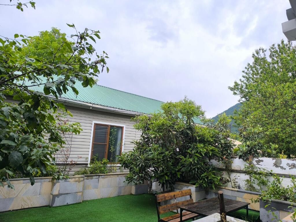 Comfort Quadruple Room, Courtyard View | Living area | 43-inch LED TV with satellite channels