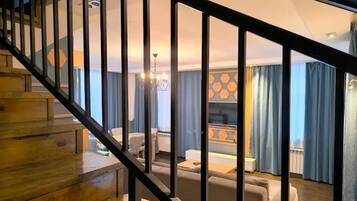 Luxury Studio Suite, Mountain View | Living area | 43-inch LED TV with satellite channels