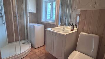Shower, towels, soap, toilet paper