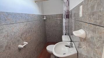 Shower, towels, soap, toilet paper