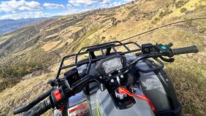 A motorcycle with a side view of a hilly landscape. - "Sleeping Woman" Accommodation (Ambuquí)