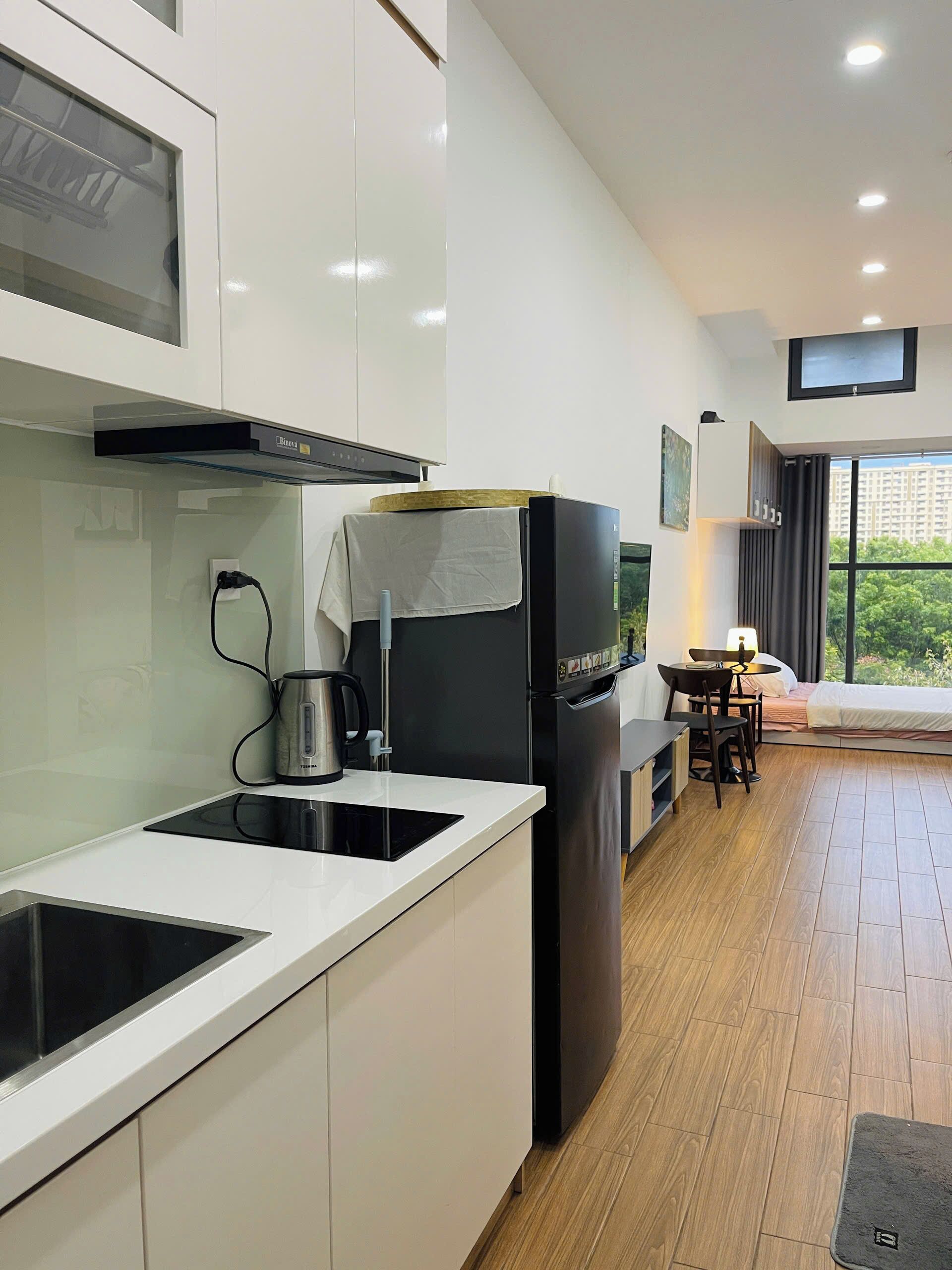Departamento de lujo, vista a la ciudad | Cocina privada | Refrigerador, parrilla de estufa y utensilios de cocina 