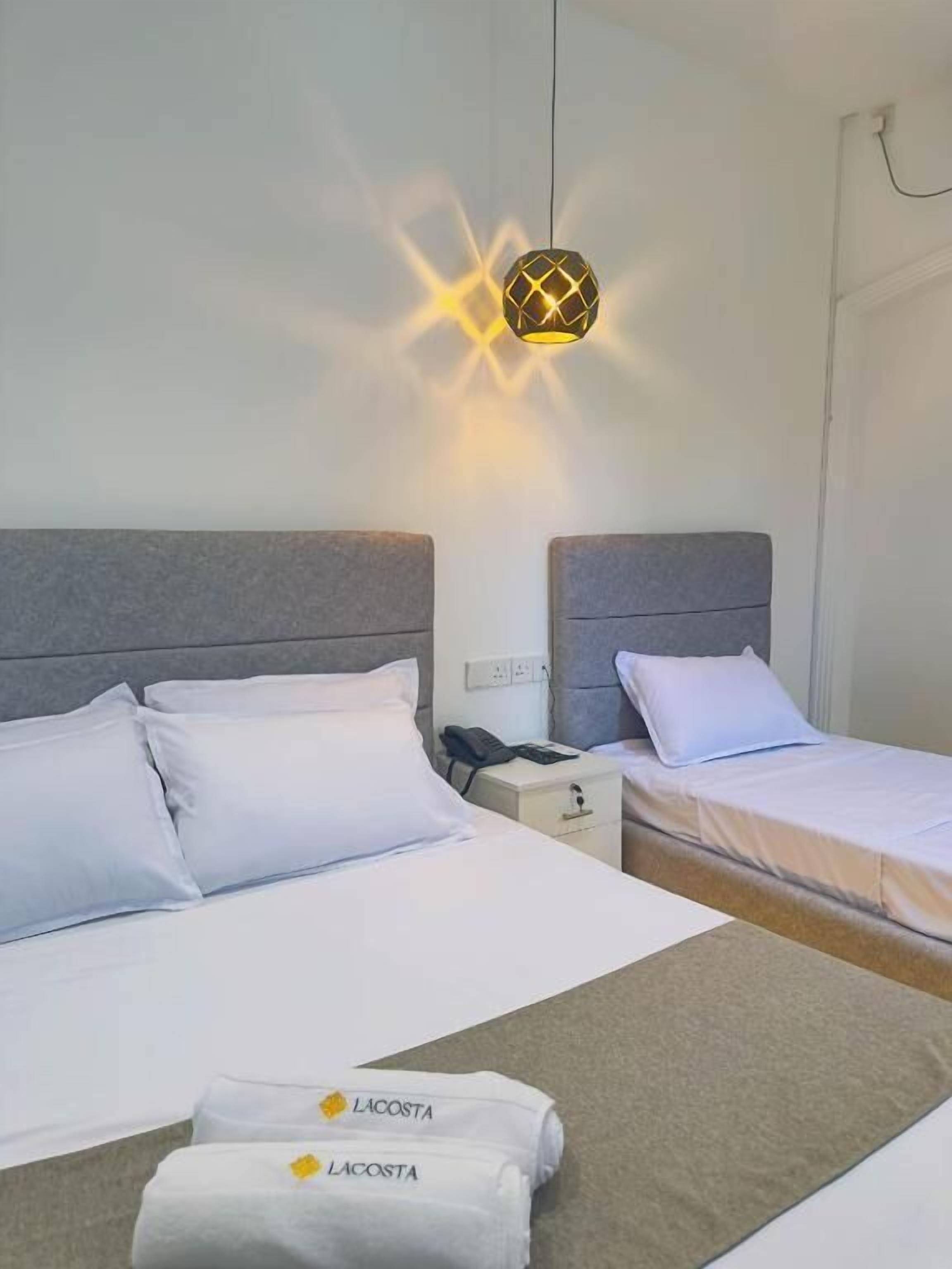 Standard Triple Room, Balcony, Pool View | In-room safe, blackout drapes, soundproofing, iron/ironing board