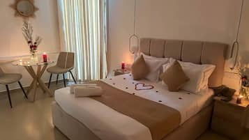 Luxury Suite, Garden View | In-room safe, blackout drapes, soundproofing, iron/ironing board