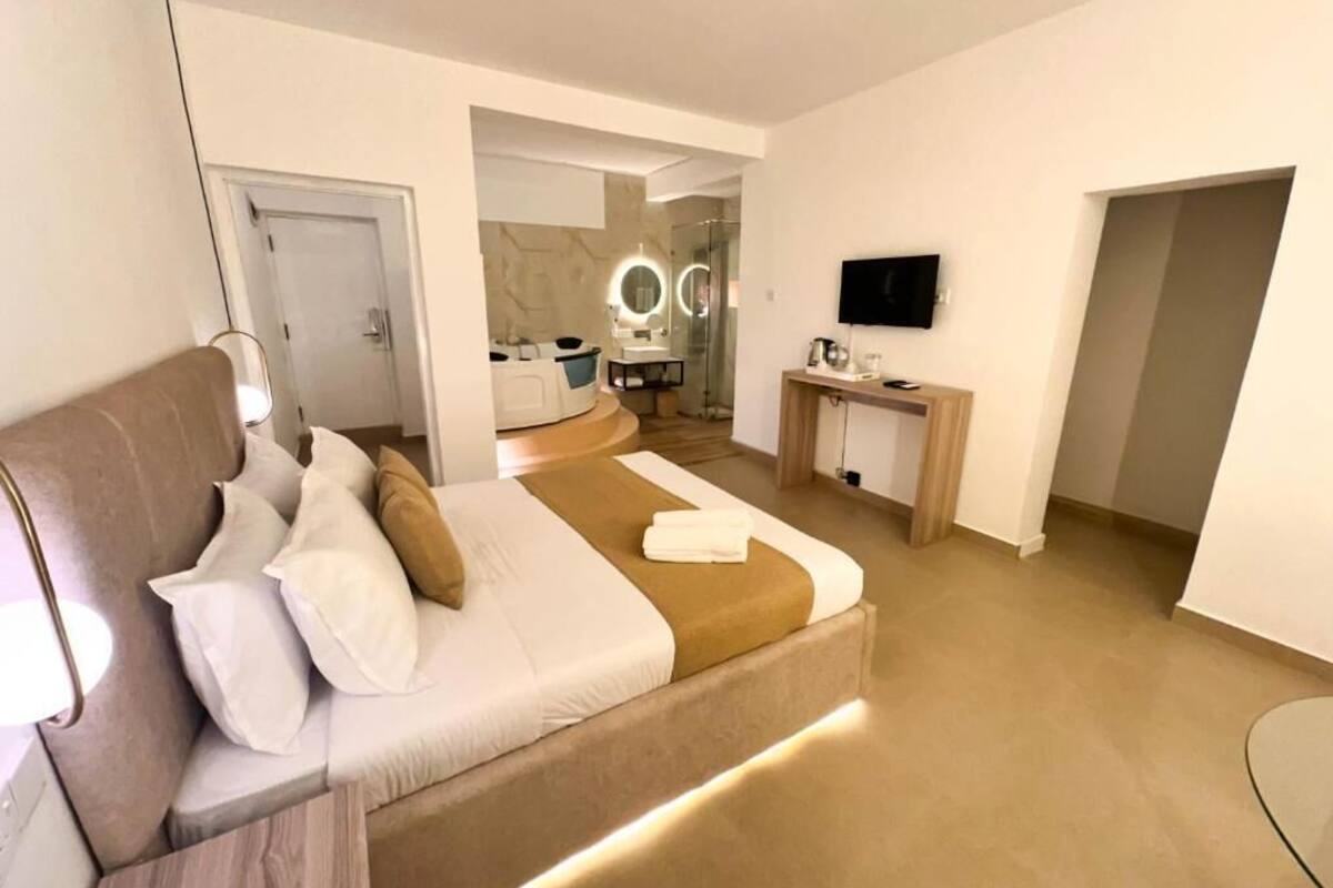 Luxury Suite, Garden View | In-room safe, blackout curtains, soundproofing, iron/ironing board