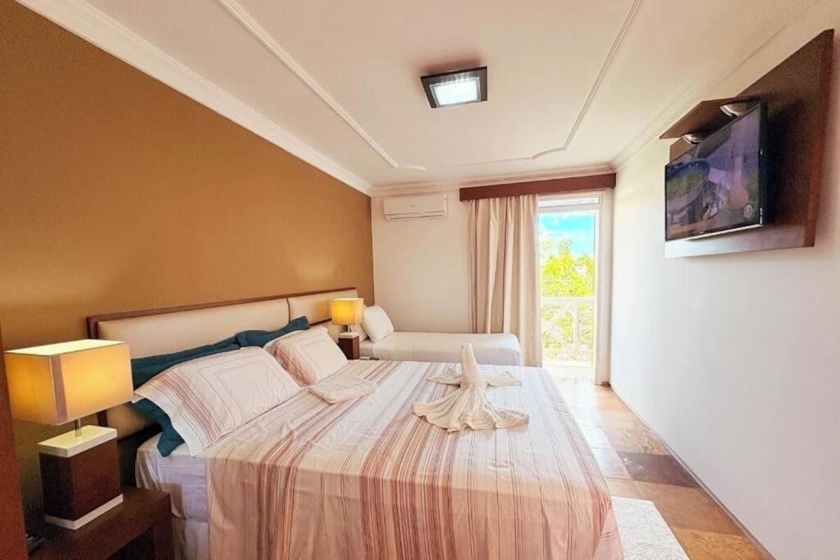 Comfort Triple Room, Lanai, Garden View | Minibar, in-room safe, desk, laptop workspace
