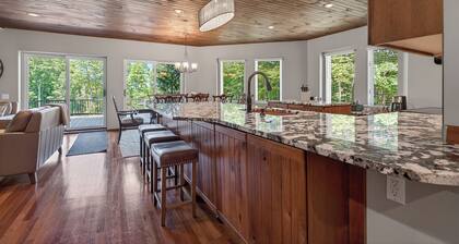 Luxury Bellaire golf resort retreat! Sleeps 12 with 4 king beds, large deck and hot tub on<br>6th green of Hawk’s Eye GC, fire pit, indoor fireplace, and many upscale finishes.<br>Includes private beach club and clubhouse pool access.