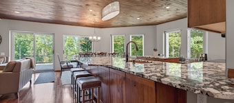 Luxury Bellaire golf resort retreat! Sleeps 12 with 4 king beds, large deck and hot tub on<br>6th green of Hawk’s Eye GC, fire pit, indoor fireplace, and many upscale finishes.<br>Includes private beach club and clubhouse pool access.