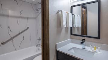 Separate bathtub and shower, towels, toilet paper