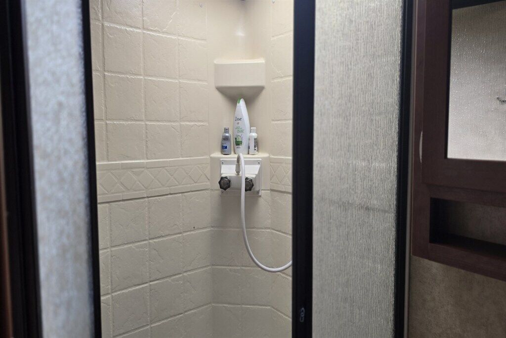 Shower, towels, soap, toilet paper