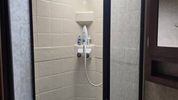 Shower, towels, soap, toilet paper