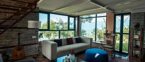 Villa Deluxe, balcón, vista al jardín | Área de sala de estar