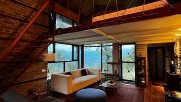 Deluxe Villa, Balcony, Garden View | Living area