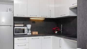 Appartement Deluxe, balcon, vue ville | Cuisine privée