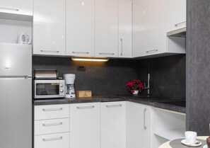 Apartamento Deluxe, balcón, vistas a la ciudad | Cocina privada
