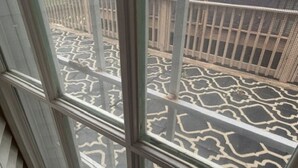 A window with a patterned view of a building's exterior. - Spacious 3BR Downtown Atlanta Home w/ Parking Minutes to Mercedes-Benz Stadium (Atlanta)