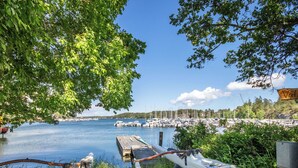 A marina with boats docked, a wooden pier, and a sign that reads 'Valley.' - Skärgårdshem by Interhome (Dalarö)
