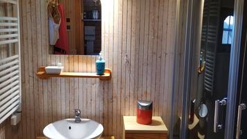 Shower, towels, soap, toilet paper