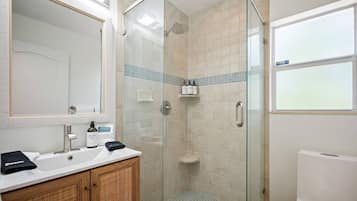 Shower, hair dryer, towels, shampoo